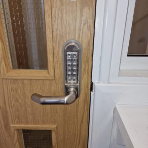 Silver Borg locks digital lock upgraded on oak office fire door.