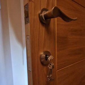 Mortice lock on brown wooden door opened and replaced with new set of keys in Clitheroe